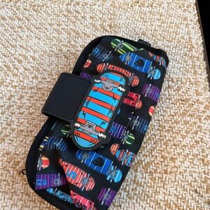 ZIPIT brand fanny pack or hip pouch, featuring a vibrant skateboard pattern